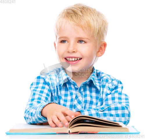 Image of Little child play with book