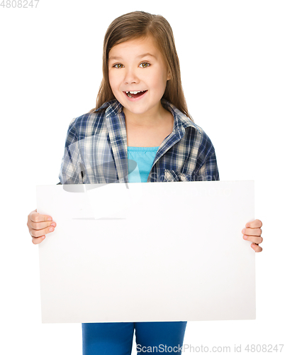 Image of Little girl is holding a blank banner