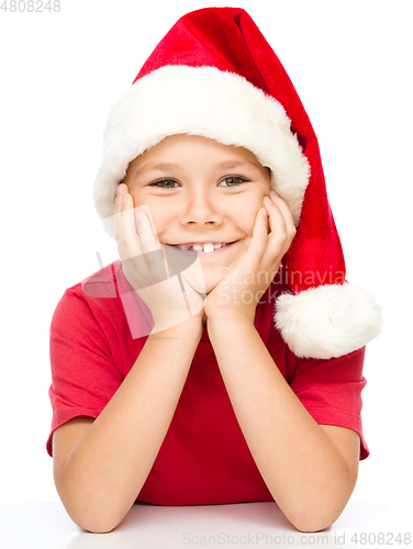 Image of Portrait of a cute little girl in santa hat