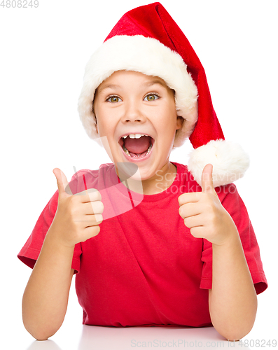 Image of Little girl is showing thumb up sign