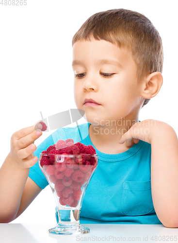 Image of Little boy with raspberries