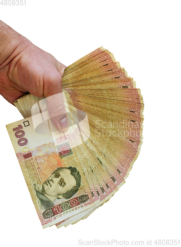 Image of Ukrainian money of value 100 in the hand isolated