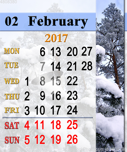 Image of calendar for February 2017 with snowy pine branches