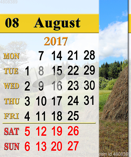 Image of calendar for August 2017 with stacks in village