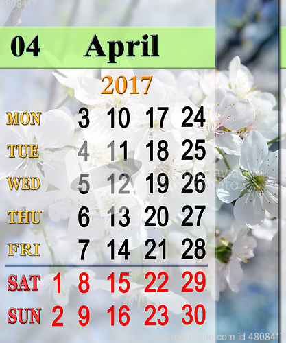 Image of calendar for May 2017 with blooming cherry tree