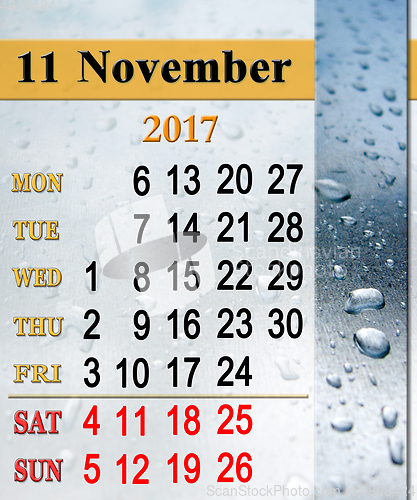 Image of calendar for November 2017 with drops of rain on the glass
