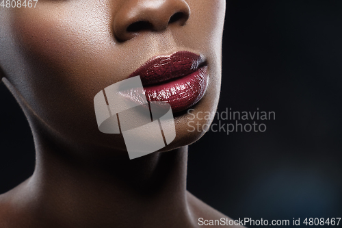 Image of beautiful black woman red lips closeup