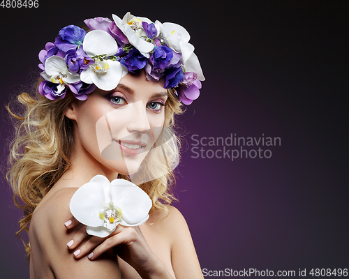 Image of beautiful blond girl with flowers