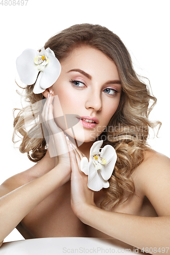 Image of beautiful blond girl with flower