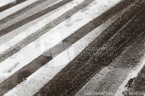 Image of traces of the car on snow