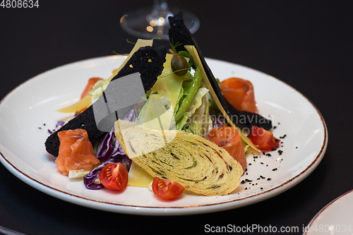 Image of Caesar salad with salmon fish