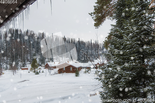 Image of Winter holiday house in forest.