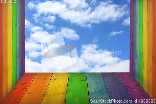 Image of view to the sky from boards in colors of rainbow