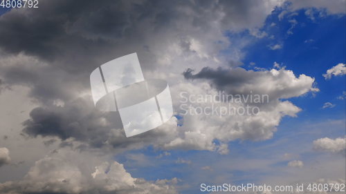 Image of Time lapse Fluffy clouds float across the blue sky. UltraHD stock footage