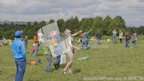 Image of MOSCOW - AUGUST 27: girl launches a kite in the park August 27, 2017 in Moscow, Russia