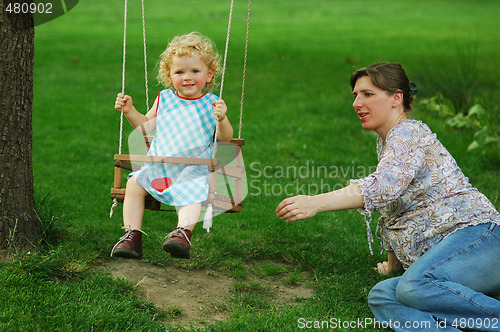 Image of Girl on seesaw