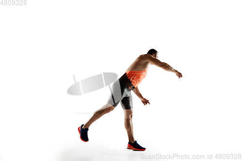 Image of Male athlete practicing in throwing javelin isolated on white studio background