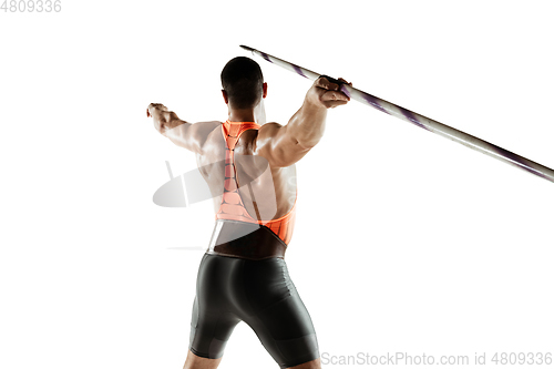 Image of Male athlete practicing in throwing javelin isolated on white studio background