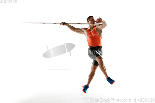 Image of Male athlete practicing in throwing javelin isolated on white studio background