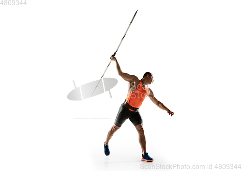 Image of Male athlete practicing in throwing javelin isolated on white studio background