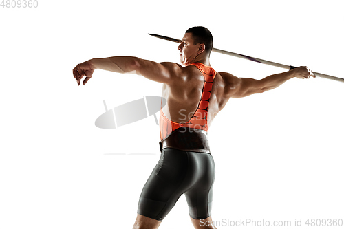 Image of Male athlete practicing in throwing javelin isolated on white studio background