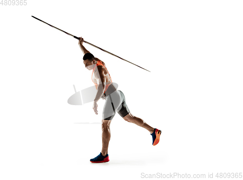 Image of Male athlete practicing in throwing javelin isolated on white studio background