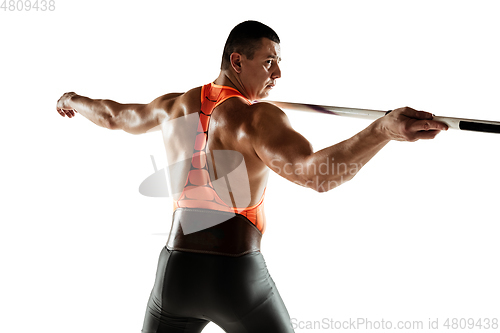 Image of Male athlete practicing in throwing javelin isolated on white studio background