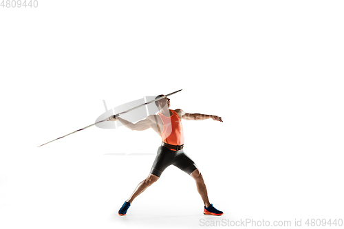 Image of Male athlete practicing in throwing javelin isolated on white studio background