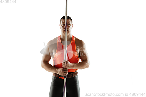 Image of Male athlete practicing in throwing javelin isolated on white studio background