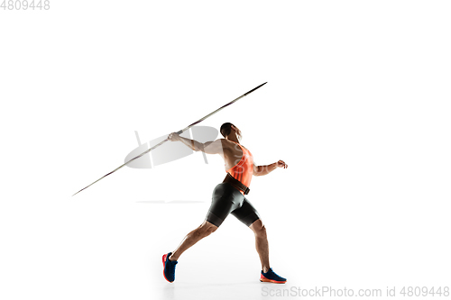 Image of Male athlete practicing in throwing javelin isolated on white studio background