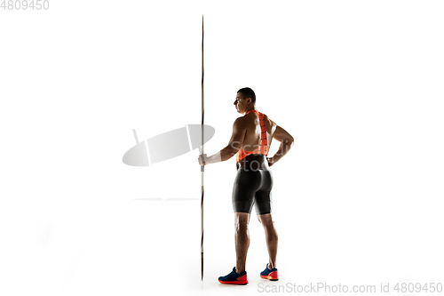 Image of Male athlete practicing in throwing javelin isolated on white studio background