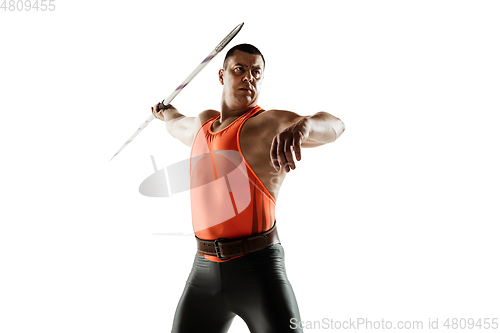 Image of Male athlete practicing in throwing javelin isolated on white studio background