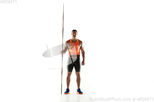 Image of Male athlete practicing in throwing javelin isolated on white studio background