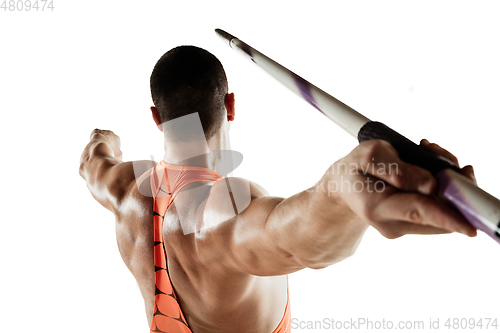 Image of Male athlete practicing in throwing javelin isolated on white studio background