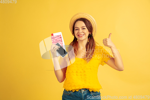 Image of Caucasian woman\'s portrait isolated on yellow studio background