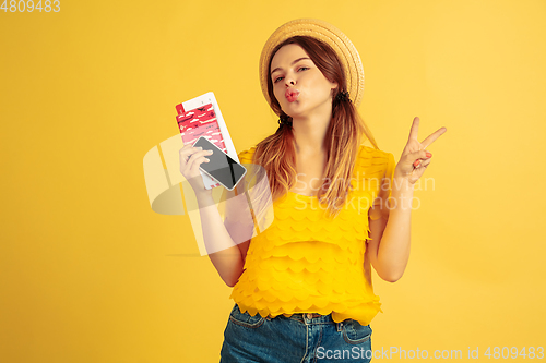 Image of Caucasian woman\'s portrait isolated on yellow studio background