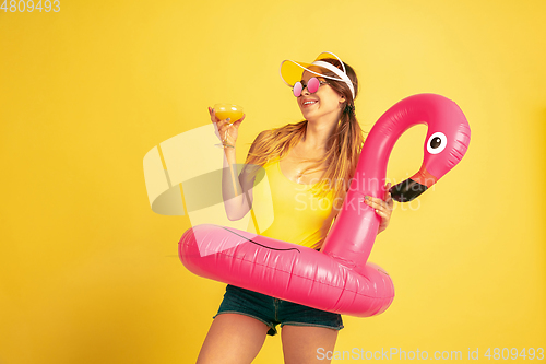 Image of Caucasian woman\'s portrait isolated on yellow studio background