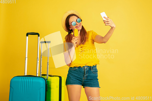 Image of Caucasian woman\'s portrait isolated on yellow studio background
