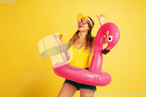 Image of Caucasian woman\'s portrait isolated on yellow studio background