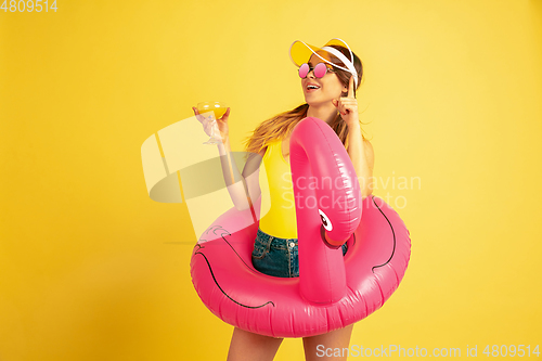 Image of Caucasian woman\'s portrait isolated on yellow studio background