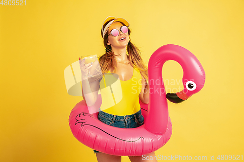 Image of Caucasian woman\'s portrait isolated on yellow studio background