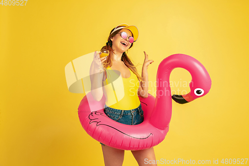 Image of Caucasian woman\'s portrait isolated on yellow studio background
