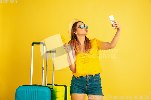 Image of Caucasian woman\'s portrait isolated on yellow studio background