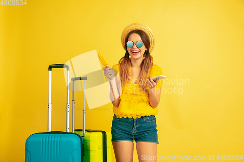 Image of Caucasian woman\'s portrait isolated on yellow studio background
