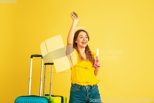 Image of Caucasian woman\'s portrait isolated on yellow studio background