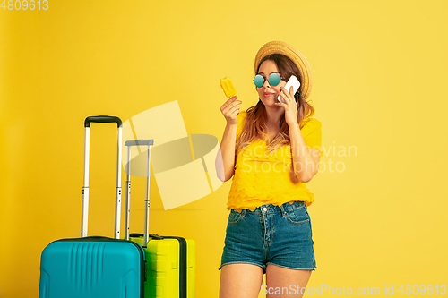 Image of Caucasian woman\'s portrait isolated on yellow studio background