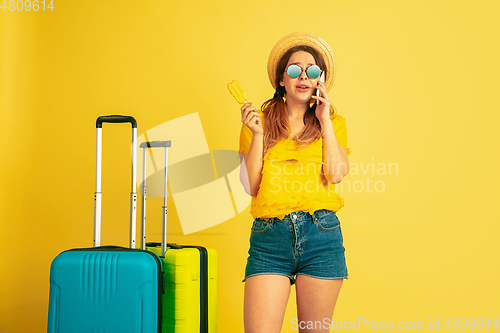 Image of Caucasian woman\'s portrait isolated on yellow studio background