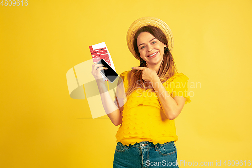 Image of Caucasian woman\'s portrait isolated on yellow studio background