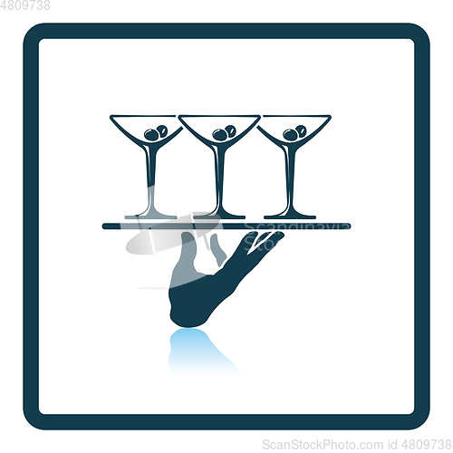 Image of Waiter hand holding tray with martini glasses icon