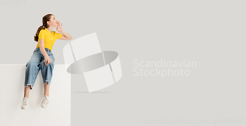 Image of Caucasian girl isolated on white studio background. Copyspace. Childhood, education, emotions concept